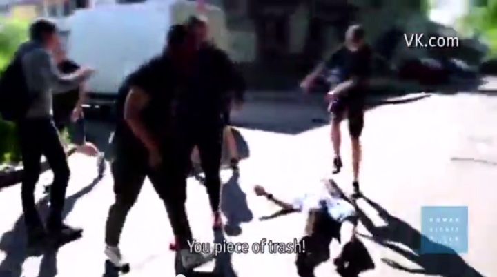 An image of a man being beaten by assailants in an anti-gay attack in Russia.