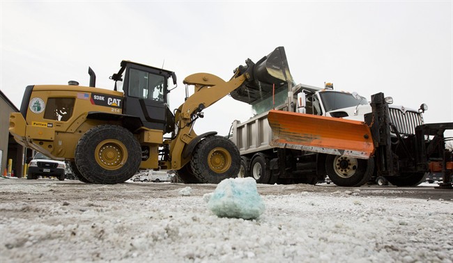 Road salt is loaded into a snow plow truck equipped with a salt spreader at the public works facility in Glen Ellyn, Ill., on Tuesday, Feb. 4, 2014.