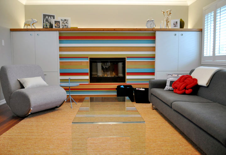 Reclaimed timber in varying depths and sizes, painted out in bright colours as a fireplace feature for a young family as shown in a Victoria, B.C., home in this undated handout photo.
