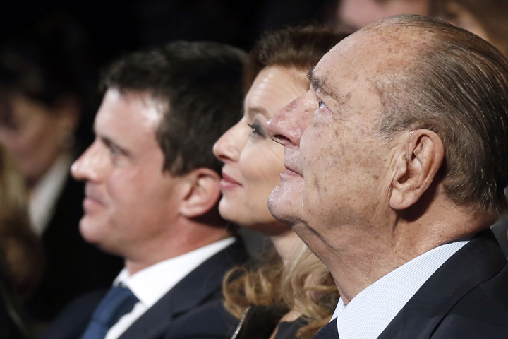 (From R) Former French President Jacques Chirac, French President Francois Hollande's companion Valerie Trierweiler, and French Interior minister Manuel Valls attend the "Prix de la Fondation Chirac" award ceremony at the Musee du Quai Branly in Paris on November 21, 2013.