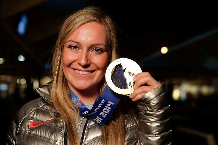 U.S. Olympian and gold medalist Jamie Anderson shows off her medal.