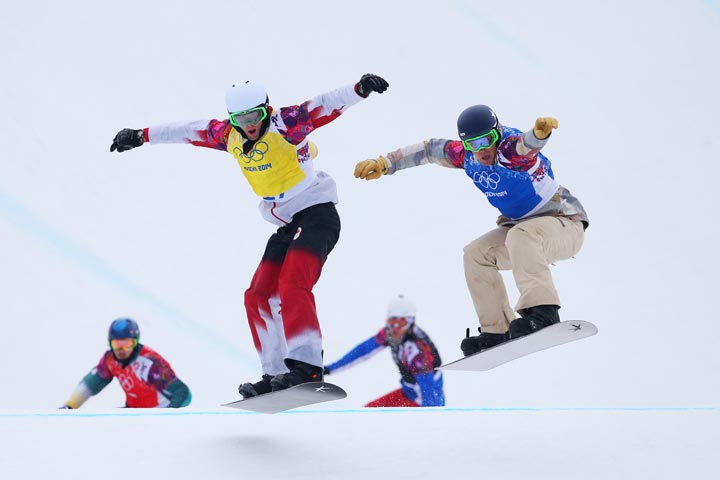 Alex Pullin of Australia (red bib), Kevin Hill of Canada (yellow bib), Tony Ramoin of France (black bib) and Alex Deibold of the United States (blue bib) compete in the Men's Snowboard Cross Quarterfinals on day eleven of the 2014 Winter Olympics at Rosa Khutor Extreme Park on February 18, 2014 in Sochi, .