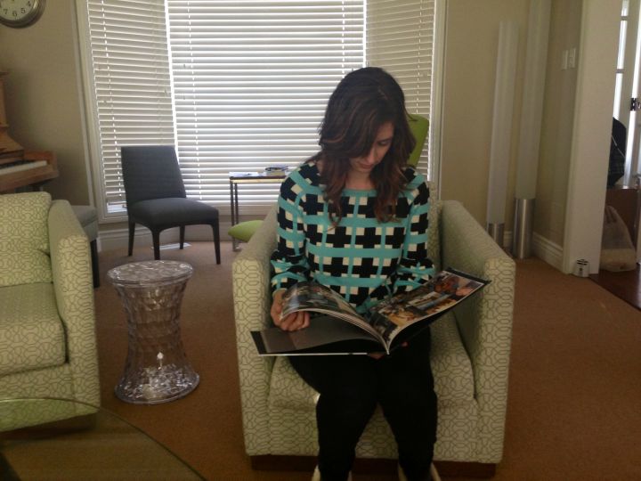 Christine McCourt-Reid looks at old photos of her husband.