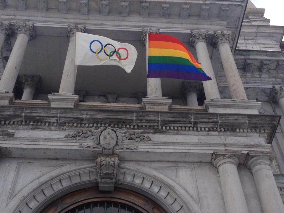 The rainbow flag flies over city hall alongside the Olympic flag in Montreal, Friday, February 7, 2014, for the duration of the Winter Olympic games in Sochi.