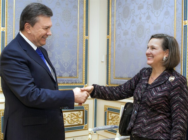 Ukraine's President Viktor Yanukovych, left, greets U.S. Assistant Secretary for European and Eurasian Affairs Victoria Nuland, in Kiev, Ukraine, Thursday, Feb. 6, 2014. 