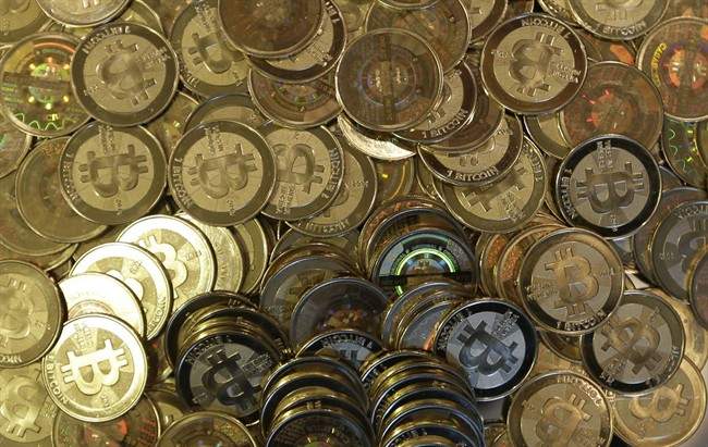 This April 3, 2013 file photo shows bitcoin tokens in Sandy, Utah. 