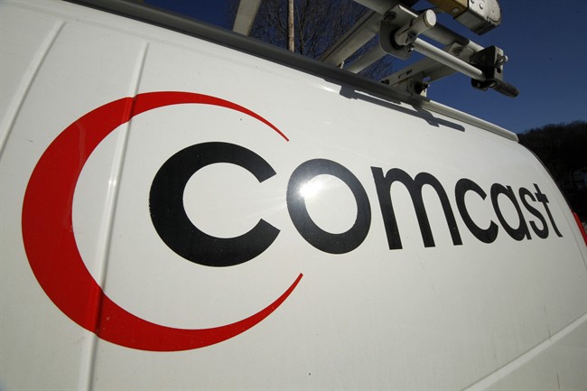 This Feb. 11, 2011 file photo shows the Comcast logo on one of the company's vehicles, in Pittsburgh. Comcast has agreed to buy Time Warner Cable for $45.2 billion in stock, or $158.82 per share, in a deal that would combine the top two cable TV companies in the nation. 