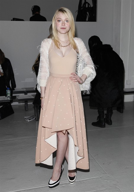 Actress Dakota Fanning attends the Rodarte 2014 Fall/Winter Collection during Mercedes Benz Fashion Week on Tuesday, Feb. 11, 2014, in New York.