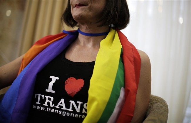 Vladimir Luxuria, a former Communist lawmaker in the Italian parliament and prominent crusader for transgender rights, wears a pro-transgender t-shirt as she sits for an interview, Monday, Feb. 17, 2014, in central Sochi, Russia.