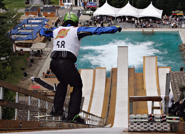 Mengtao Xu of China leaps as she takes off on the ramp on her way to a gold medal at the world AcrobatX freestyle aerial competition at the Yves Laroche summer training facility Saturday, Aug. 8, 2009 in Lac Beauport Que.