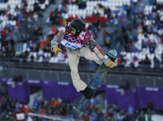 Shaun White of the United States competes during the men's snowboard halfpipe qualifying session at the Rosa Khutor Extreme Park, at the 2014 Winter Olympics, Tuesday, Feb. 11, 2014, in Krasnaya Polyana, Russia.