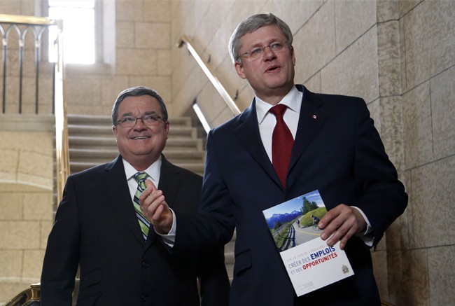 Jim Flaherty and former prime minister Stephen Harper on Parliament Hill in Ottawa on Tuesday, February 11, 2014.