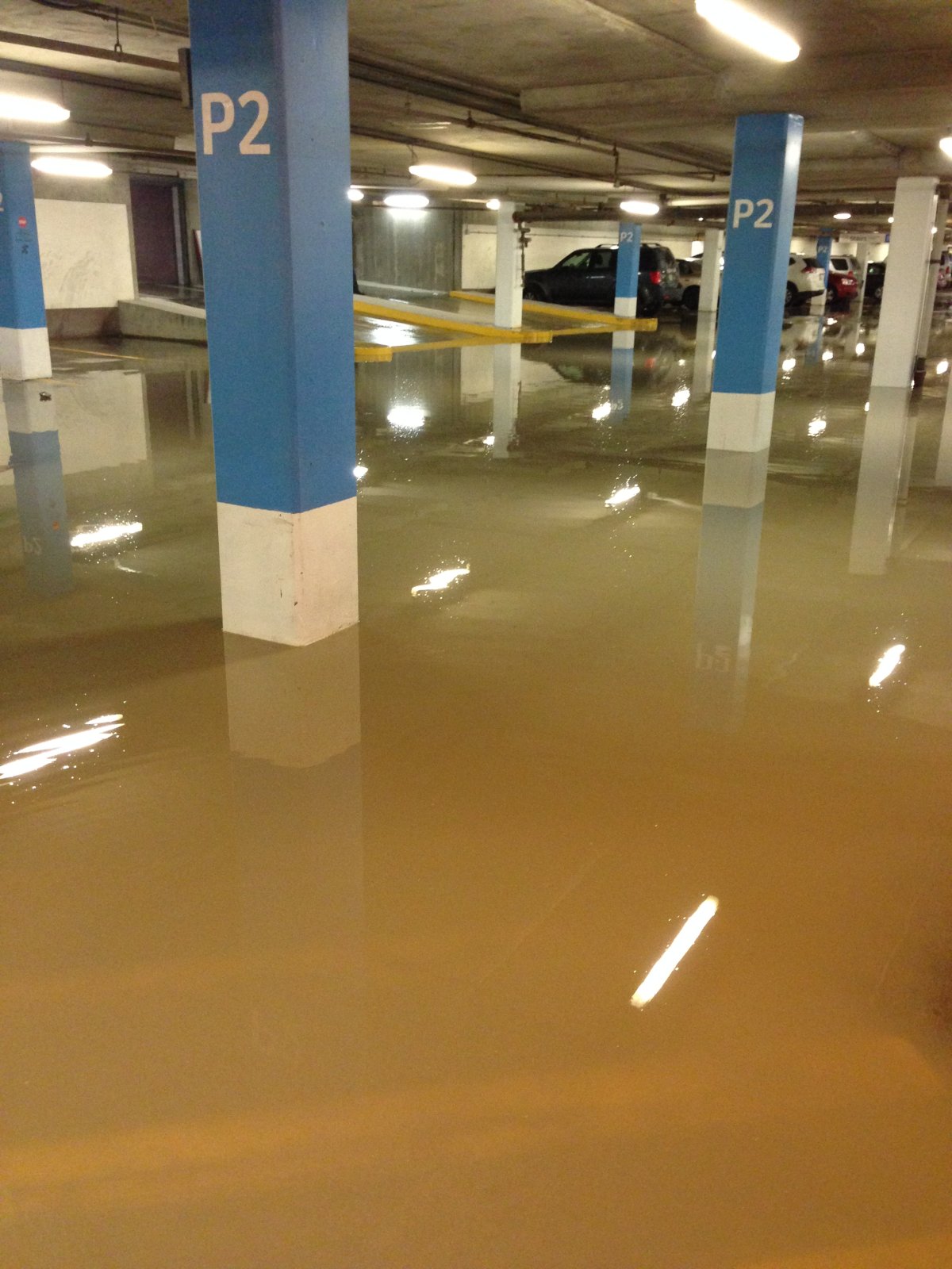 Portage Place Parkade flooded after a water main break .