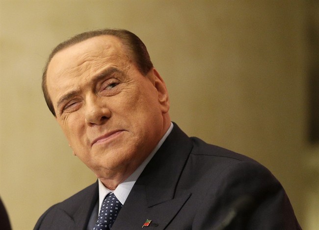 In this Dec. 4, 2013 photo former Premier Silvio Berlusconi attends the launch of a book "Sale, zucchero e caffe'" (Salt, Sugar and Coffee) by his friend, journalist Bruno Vespa, in Rome.
