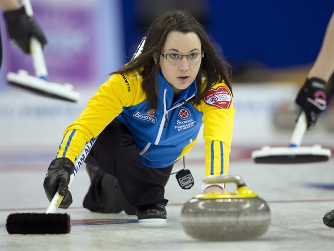 Alberta skip Val Sweeting takes a shot during her match against Quebec at the Scotties Tournament of Hearts draw fourteen curling action Thursday, February 6, 2014 in Montreal.