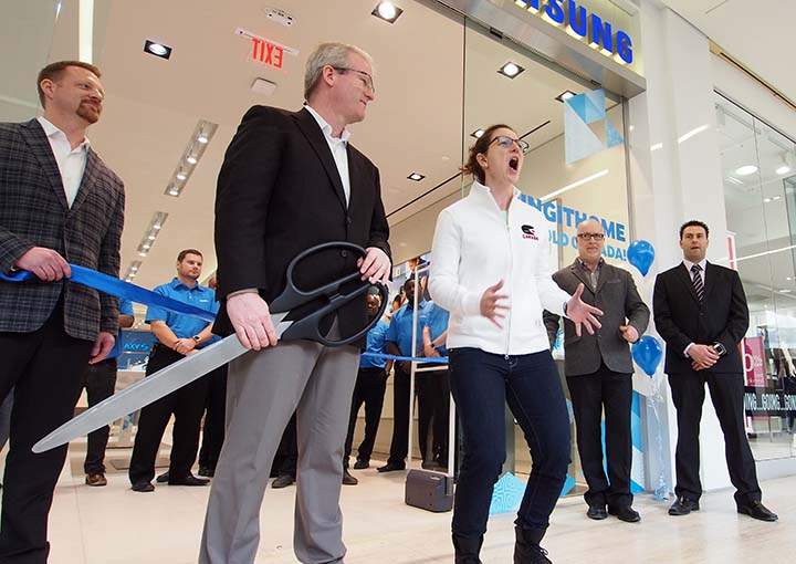 Special guest Olympic Gold medalist Gillian Ferarri lends her spark next to Samsung Canada President James Politeski at new WEM store