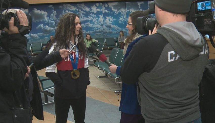 Shannon Szabados talks to media at the Edmonton International Airport Tuesday evening.