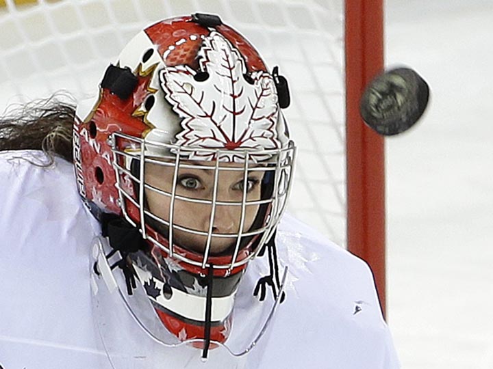 Goalkeeper Shannon Szabados of Canada looks for the rebound on a blocked shot against Switzerland during the first period of the 2014 Winter Olympics women's semifinal ice hockey game at Shayba Arena, Monday, Feb. 17, 2014, in Sochi, Russia. 
