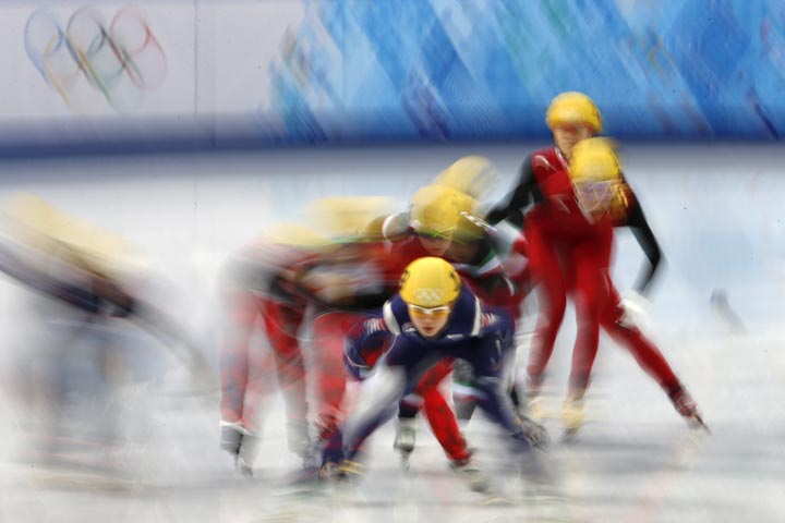 Skaters compete in the Women’s Short Track 3000 m Relay Final at the Iceberg Skating Palace during the Sochi Winter Olympics on February 18, 2014. (ADRIAN DENNIS/AFP/Getty Images)
