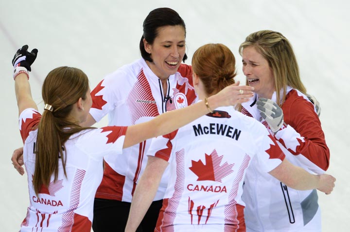 Canadian team members from left to right : Kaitlyn Lawes, Jill Officer, Dawn McEwen and Jennifer Jones celebrate winning gold in the Women's Curling Gold Medal Game Canada vs Sweden at the Ice Cube Curling Center during the Sochi Winter Olympics on February 20, 2014. (Jung YEon-Je/AFP/Getty Images)
.