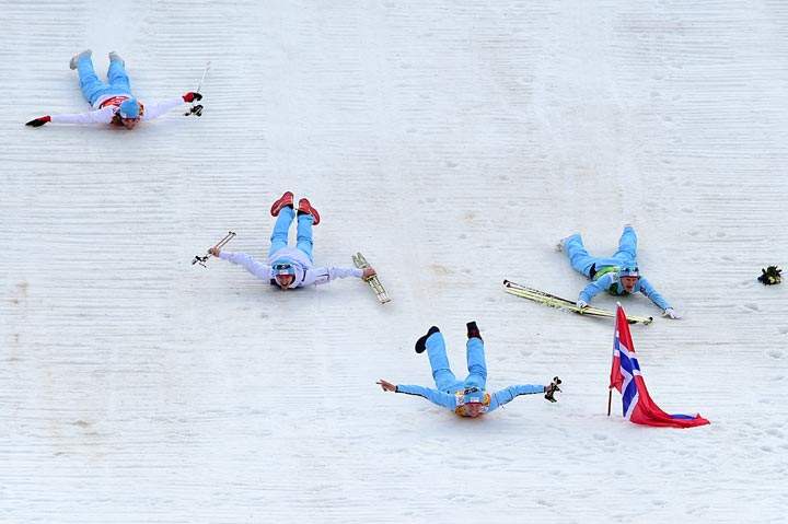 Norway’s gold medalists Magnus Hovdal Moan, Magnus Krog, Haavard Klemetsen and Joergen Graabak celebrate after the Nordic Combined Team LH / 4×5 km Cross-Country Flower Ceremony at the RusSki Gorki Jumping Center during the Sochi Winter Olympics on February 20, 2014, in Rosa Khutor near Sochi. (John MacDougall/AFP/Getty Images)