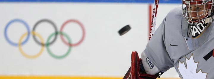 Goalkeeper of Canada’s women’s ice hockey team Shannon Szabados eyes a puck during a practice session ahead of the 2014 Winter Olympics, Thursday, Feb. 6, 2014, in Sochi, Russia. (AP Photo/Petr David Josek)