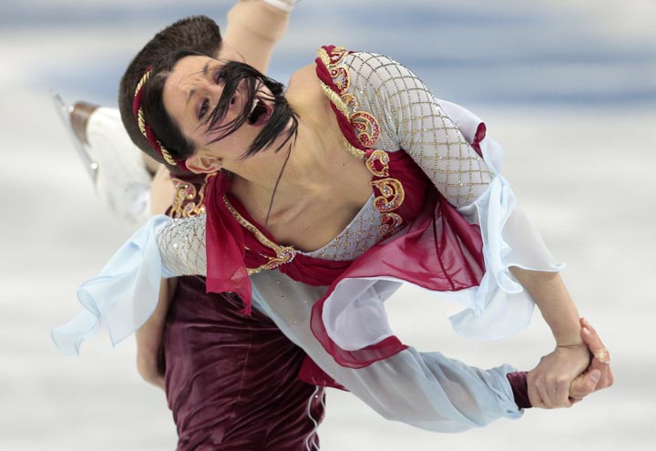 Charlene Guignard and Marco Fabbri of Italy compete in the team free ice dance figure skating competition at the Iceberg Skating Palace during the 2014 Winter Olympics, Sunday, Feb. 9, 2014, in Sochi, Russia. (AP Photo/Ivan Sekretarev)