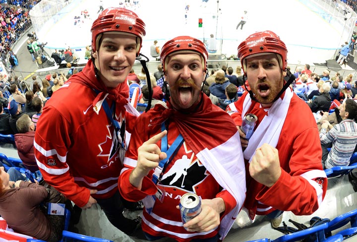 Canadian fans pose during the Women’s Ice Hockey Group A match USA vs Canada at the Shayba Arena during the Sochi Winter Olympics on February 12, 2014. (Andrej Isakovic/AFP/Getty Images)