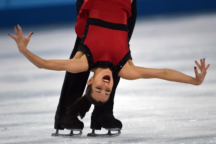 Russia’s Fedor Klimov and Russia’s Ksenia Stolbova perform their Figure Skating Pairs Free Program at the Iceberg Skating Palace during the Sochi Winter Olympics on February 12, 2014. (Damien Meyer/AFP/Getty Images)