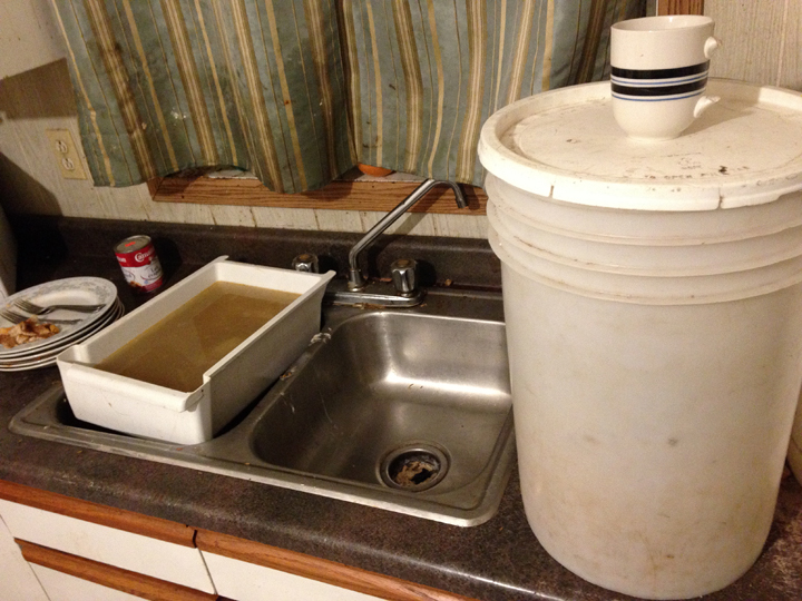 Many homes on Manitoba First Nations - like this one in St. Theresa Point - lack running water.