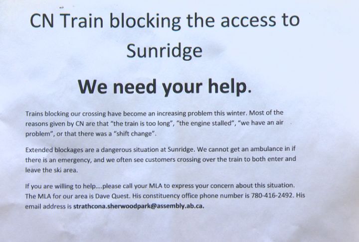 Sunridge signage warning skiers of halted trains.