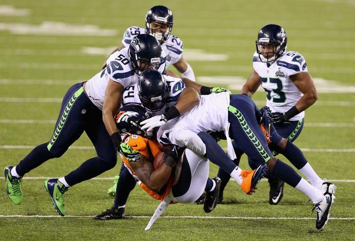Wide receiver Demaryius Thomas of the Denver Broncos is tackled during Super Bowl XLVIII against the Seattle Seahawks at MetLife Stadium on February 2, 2014 in East Rutherford, New Jersey. (Christian Petersen/Getty Images)