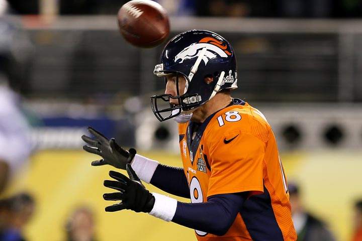 The ball flies over the head of quarterback Peyton Manning of the Denver Broncos in the first quarter against the Seattle Seahawks during Super Bowl XLVIII at MetLife Stadium on February 2, 2014 in East Rutherford, New Jersey. (Kevin C. Cox/Getty Images)