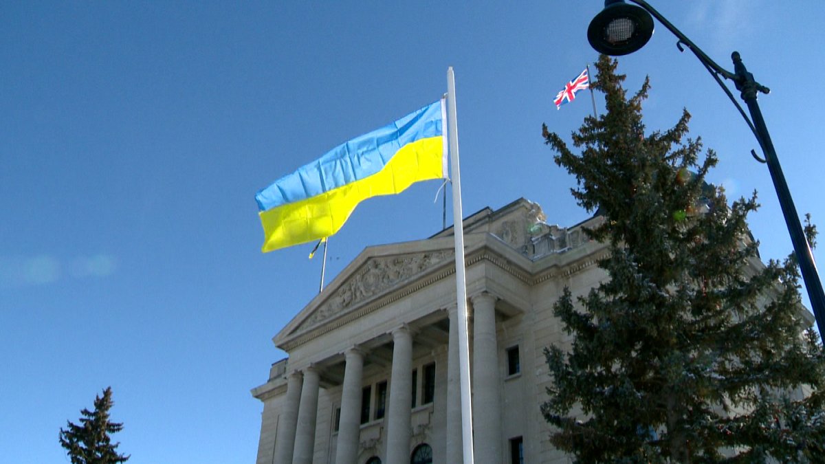 The blue-and-yellow horizontal stripes of the Ukrainian flag are flying outside the Saskatchewan legislature.