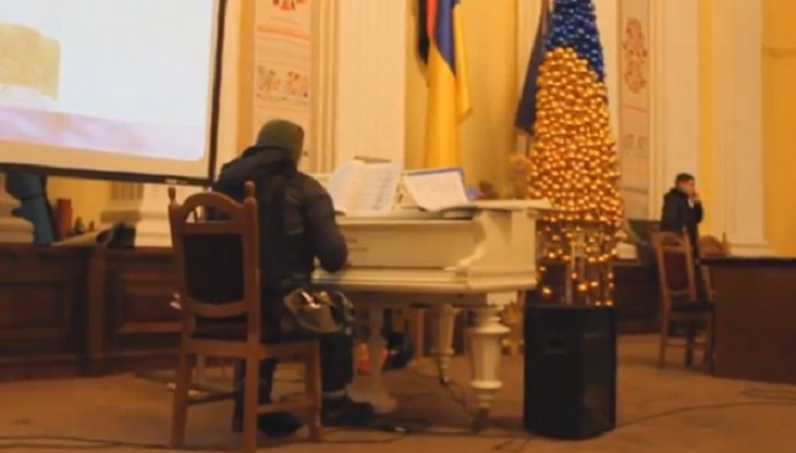 An unidentified protester known as the "Pianist-Extremist" plays the piano in a video posted to YouTube on Jan. 29.