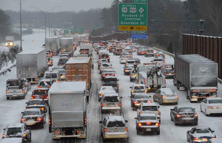 Northbound on Interstate 85 is at a standstill at rush-hour on February 12, 2014 in Durham, North Carolina. Snow fell hard and fast in central North Carolina, resulting in snarled traffic, abandoned cars and vehicular accidents by mid-afternoon.  