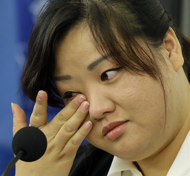 FILE - This Oct. 30, 2013 file photo shows Jin hye Jo wiping a tear as she testifies during a hearing of the United Nations mandated Commission of Inquiry about the human rights situation in the Democratic People's Republic of Korea, in Washington. 