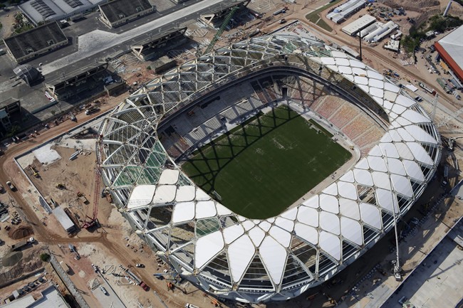 This Dec. 10, 2013 file photo shows an aerial view of the Arena da Amazonia stadium in Manaus, Brazil. A worker was injured in an accident outside this World Cup stadium, local organizers said Friday, Feb. 7, 2014. Organizers in charge of the stadium's construction said the worker was hurt while dismantling a crane that was used to install the roof. 