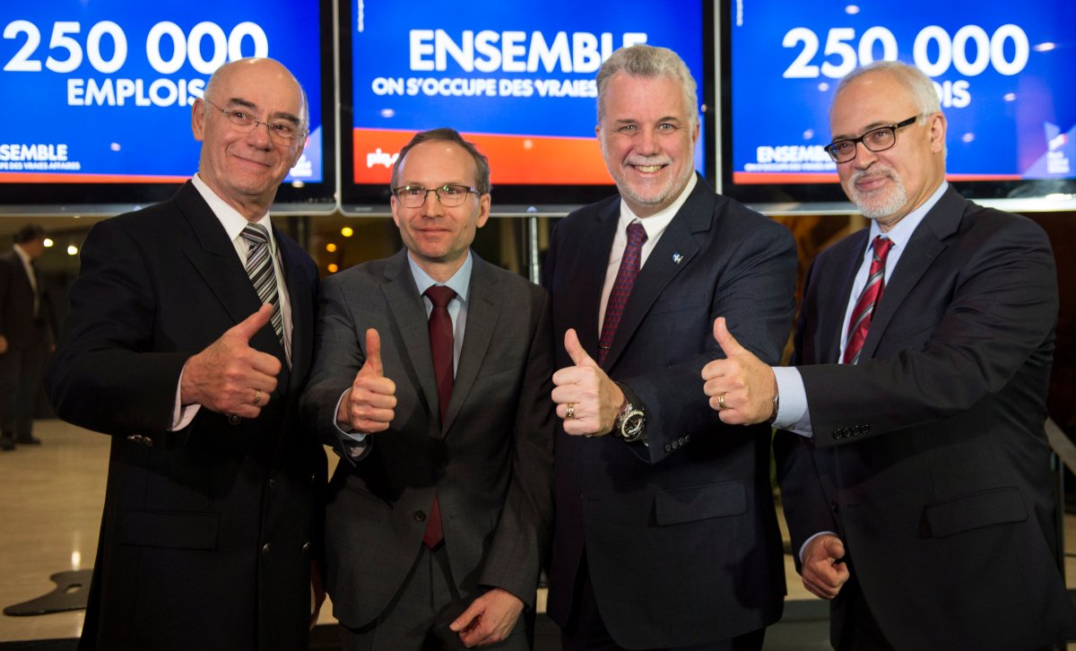 Quebec Liberal leader Philippe Couillard introduces three candidates Jacques Daoust, Martin Coiteux and Carlos Leitao, left to right, .