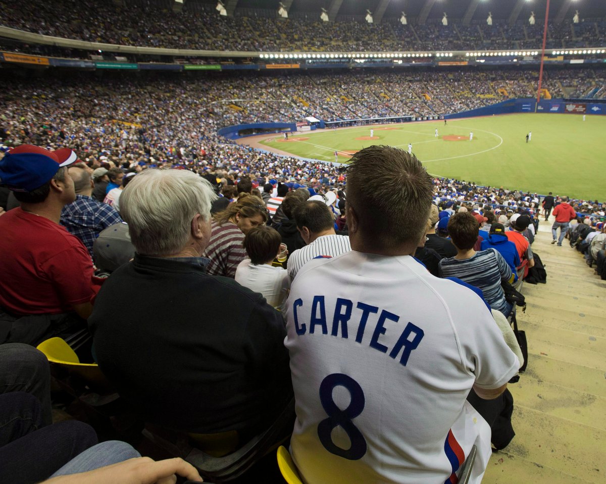 Fans crowd the outfield at Olympic Stadium prior to the Montreal