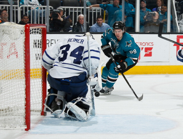 Logan Couture #39 of the San Jose Sharks skates after the puck against James Reimer #34 of the Toronto Maple Leafs during an NHL game on March 11, 2014 at SAP Center in San Jose, California. (Photo by Don Smith/NHLI via Getty Images).
