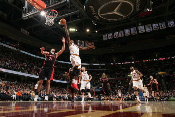  Dion Waiters #3 of the Cleveland Cavaliers goes up for the shot against Greivis Vasquez #21 of the Toronto Raptors at The Quicken Loans Arena on March 25, 2014 in Cleveland, Ohio.