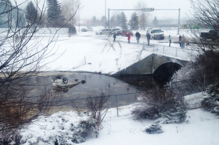 A man was pulled unconscious from a submerged vehicle in Airdrie. He later died.