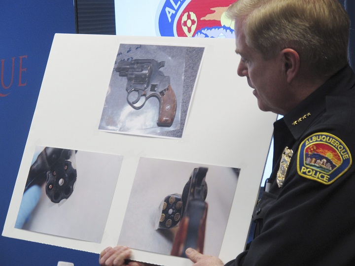 Albuquerque Police Chief Gorden Eden discusses a gun found on a man shot by police during a news conference, Wednesday, March 26, 2014, at Albuquerque Police headquarters in Albuquerque, N.M.