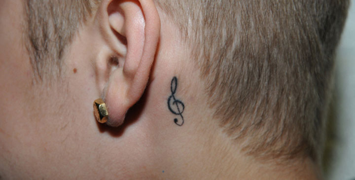 Justin Bieber tattoo behind ear