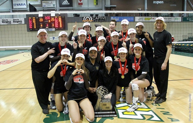 The Bisons women's volleyball team celebrates its 2014 CIS Championship.