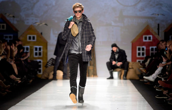 A model walks the runway in the Bustle show, part of Toronto Fashion Week in Toronto on Thursday March 20, 2014. 