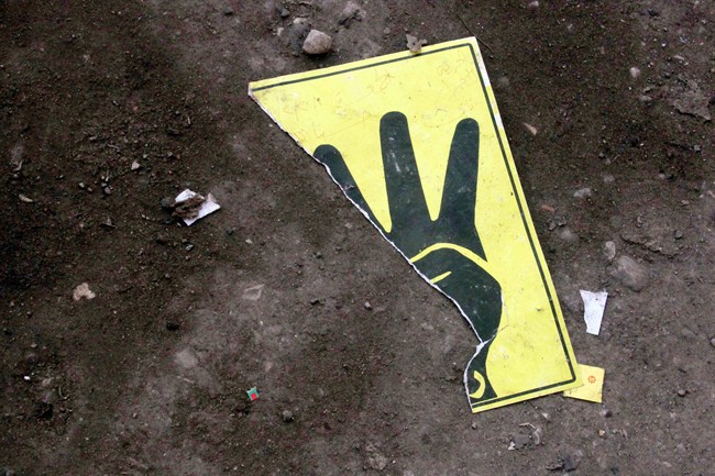 A poster belonging to supporters of ousted President Mohammed Morsi lies torn on the ground during clashes with security forces in Cairo, Egypt, Friday, Feb. 28, 2014. (AP Photo/Emad Abul Rahman).