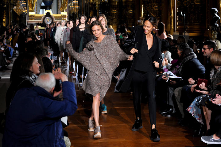 Cara Delevigne and Joan Smalles walk the runway during the Stella McCartney show as part of the Paris Fashion Week Womenswear Fall/Winter 2014-2015 on March 3, 2014 in Paris, France.