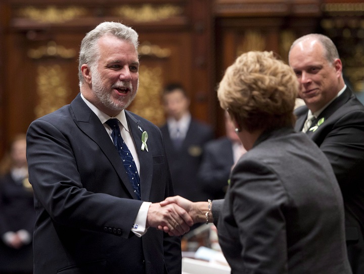Quebec Liberal Leader Philippe Couillard is greeted by Quebec Premier Pauline Marois on Tuesday, February 11, 2014 at the legislature in Quebec City.